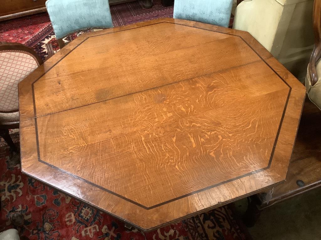A Regency oak and ebony line inlaid octagonal topped breakfast table, width 138cm, height 72cm